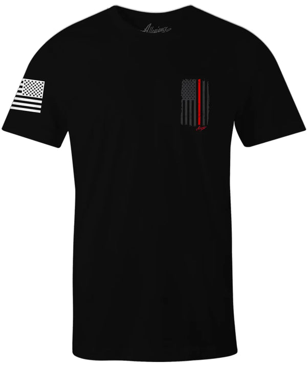 Front of Back the Red Back Hit Tee in black featuring small Thin Red Line flag graphic on the left chest and American flag on the sleeve.